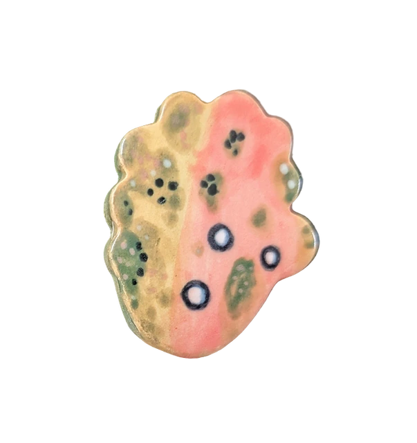 A small glazed tile in pink and green, an ongoing material experiment